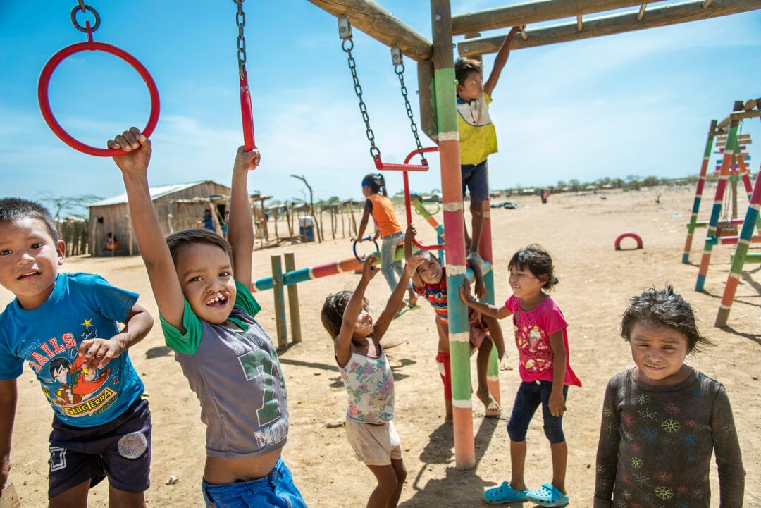 Pedro and his friends play at the April Third refugee camp in Uribia, Colombia. Photo: Rohanna Mertens.