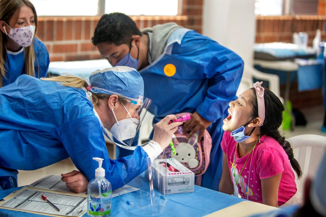 Volunteer surgeon Petra Peterson examines patient during medical programme in Guatemala City. Photo: Carlos Rueda