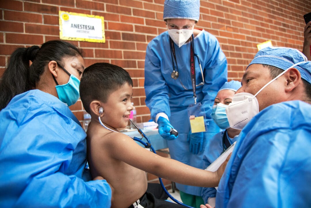 Three-years-old John with volunteer medical team before cleft surgery, Guatemala City.  Photo: Rohanna Mertens