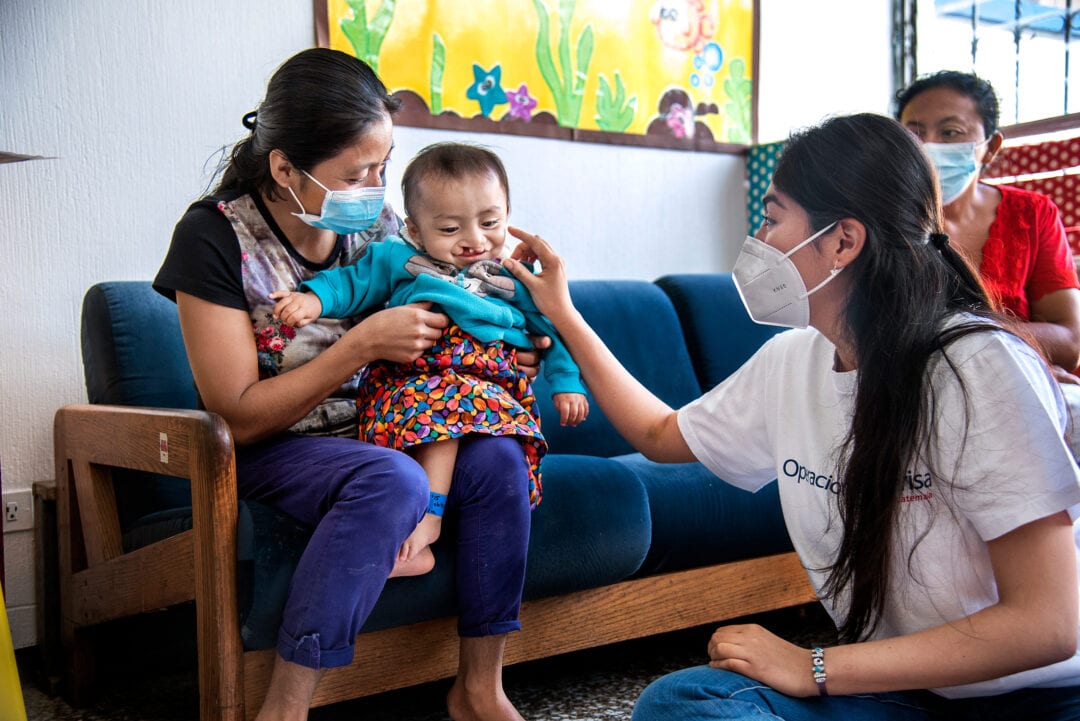 Volunteer nutritionist Monica Arredondo with ten-months-old Jobito, Guatemala City. Photo: Rohanna Mertens