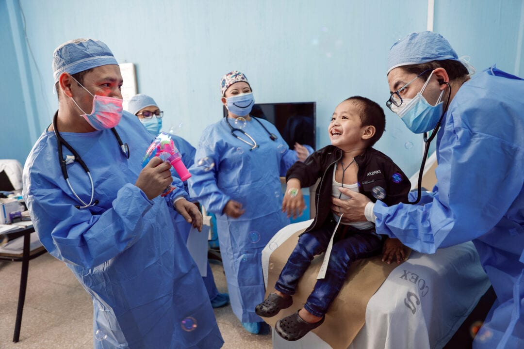 Volunteer medical team with three-years-old Jorge, before cleft surgery. Photo: Jasmin Shah