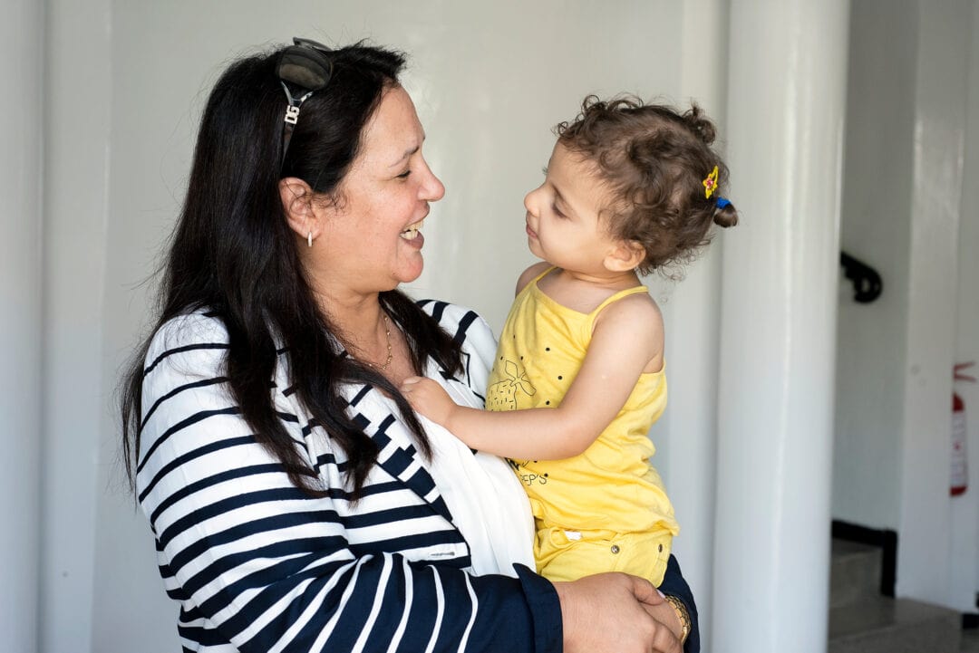 Operation Smile Morocco Co-Founder and Vice President, Fouzia Mahmoudi with patient. Photo: Margherita Mirabella