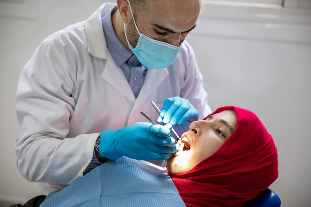 During the years that followed her surgery, orthodontist Dr. Abderrahman Harouga of Morocco performed Siham’s ongoing dental care. Photo: Lorenzo Monacelli