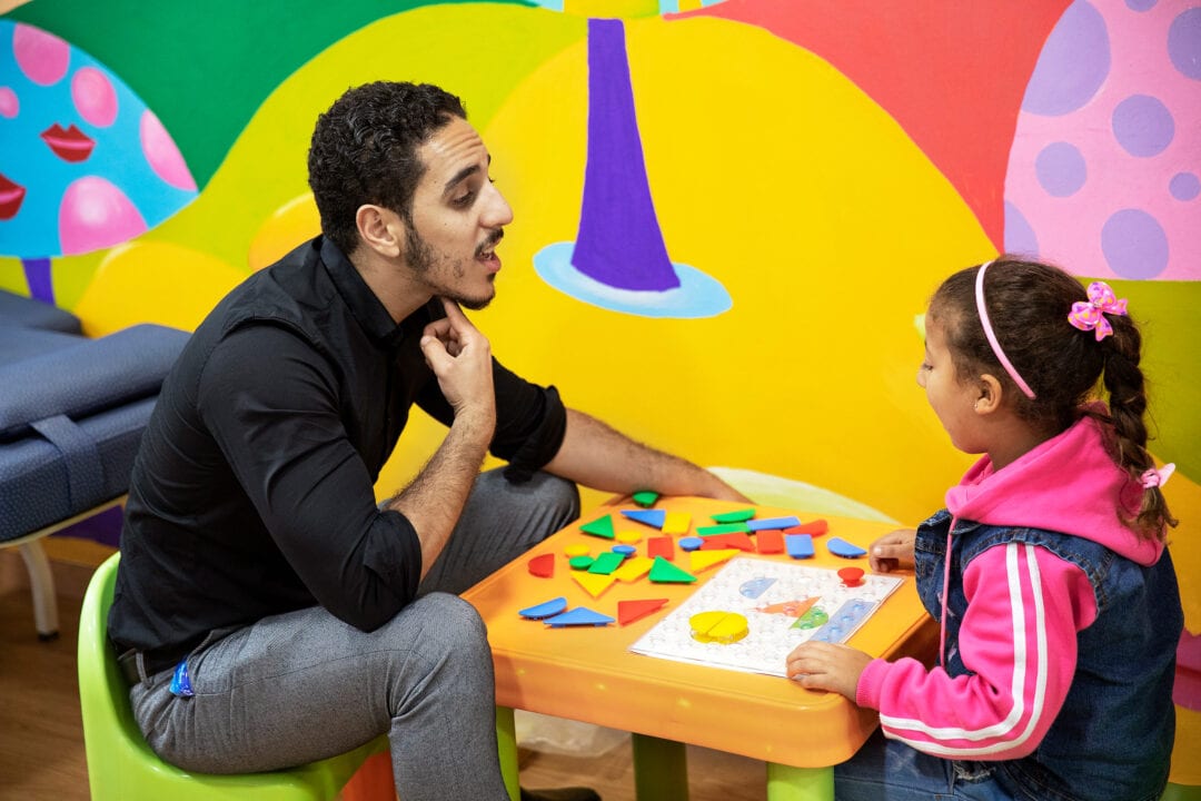 Volunteer speech therapist Othman El Hammouni during a therapy session with patient at the care centre in Casablanca. Photo: Lorenzo Monacelli