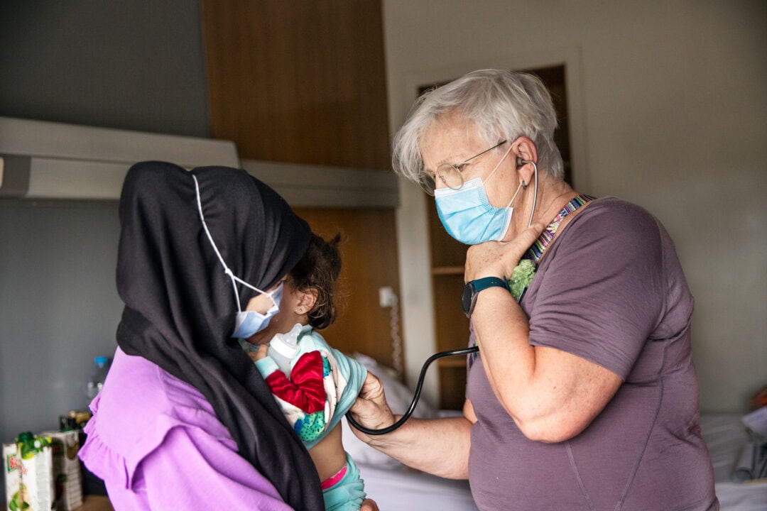 Volunteer anaesthesiologist Dr. Anne-Marie Banning from Sweden examines Janat during her comprehensive health evaluation. Photo: Jasmin Shah.