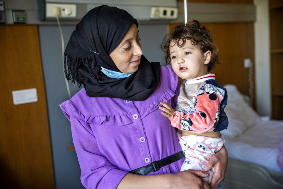 Fatima is filled with happiness and joy as she holds Janat after the surgery that repaired her daughter’s cleft lip. Photo: Jasmin Shah.