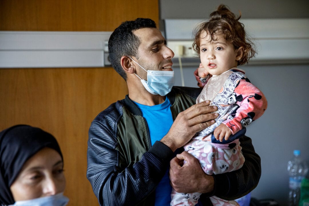 Janat’s dad, Youssef, can't contain his joy after seeing his daughter for the first time after her surgery. Photo: Jasmin Shah.