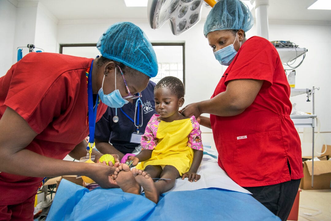 Anaesthesiologist, Godfrey Phiri and Child-life specialist, Faith Cheonga, tending to Malita  Photo: Margherita Mirabella