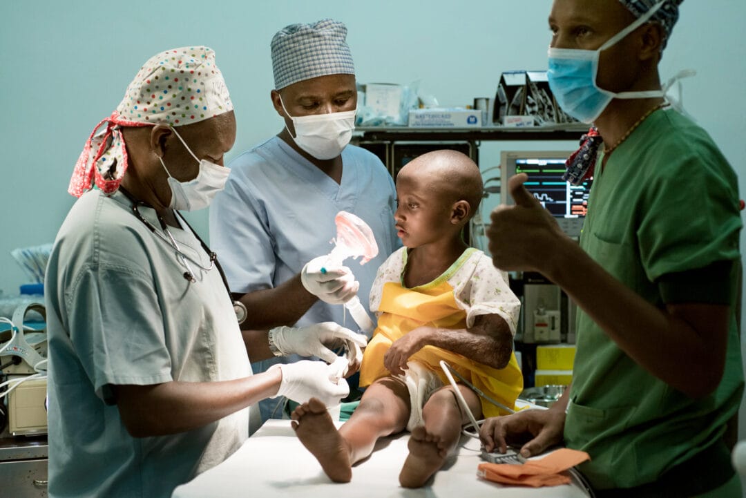 Medical staff prepare a patient for anaesthesia