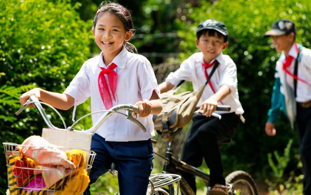 Girl in school uniform with peers