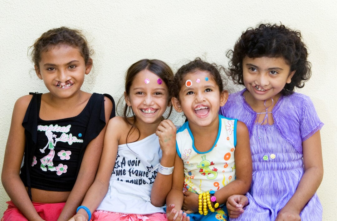 Antonia and her new friends, at Operation Smile Brazil programme in 2006. Photo: Marc Ascher