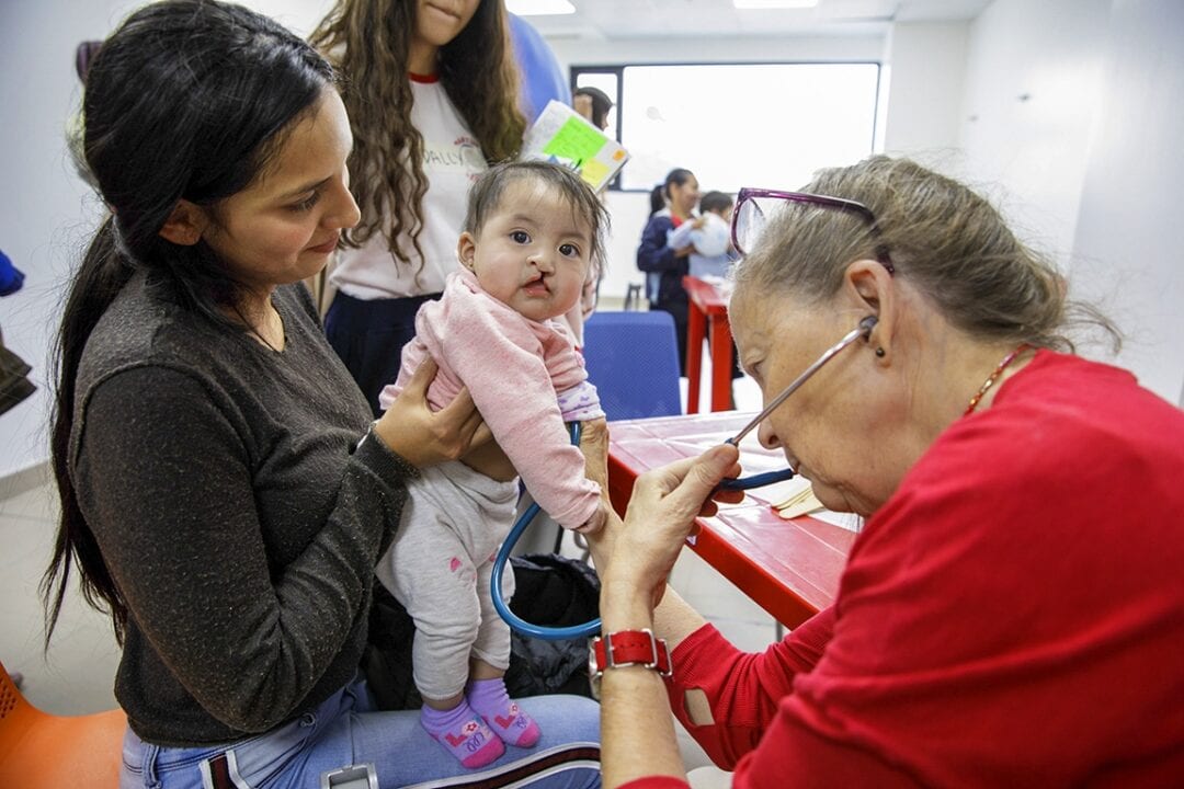 Volunteer paediatrician Dr. Elaine Kennedy with Genesis. Photo: Lorenzo Monacelli