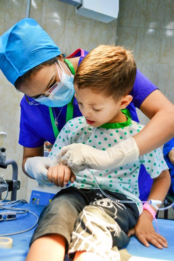 Operation Smile Egypt volunteer operating room nurse Manal Ramsis cares for a Libyan patient before their surgery. Operation Smile photo.