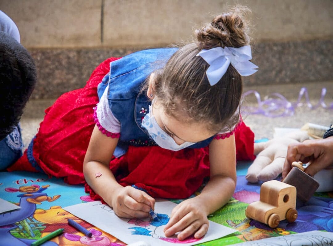 A Libyan patient plays in the child life area while they wait for cleft surgery during Operation Smile Egypt's July 2021 surgical programme. Operation Smile photo.