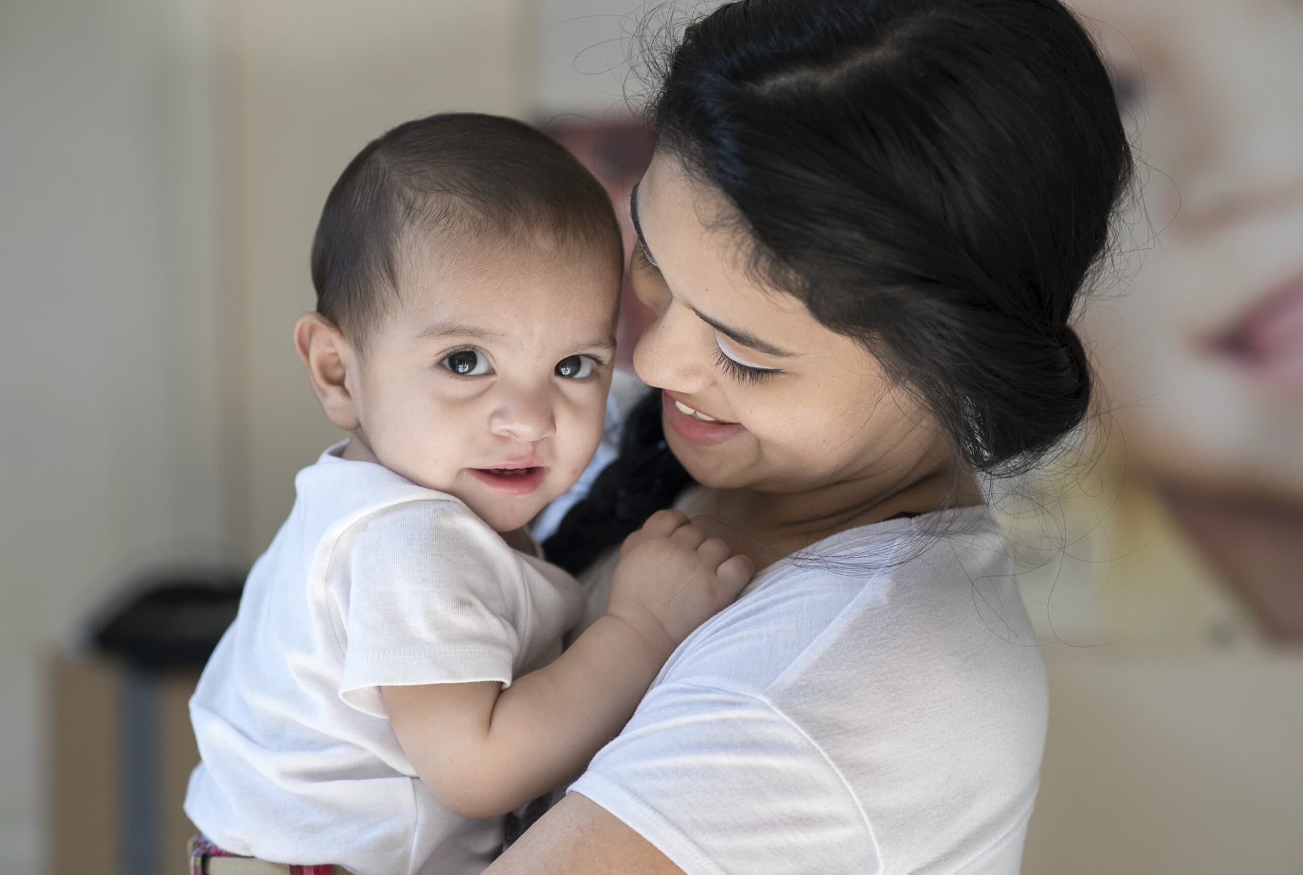 Mum holds, eight-month-old Gael, after cleft surgery. Photo: Rohanna Mertens