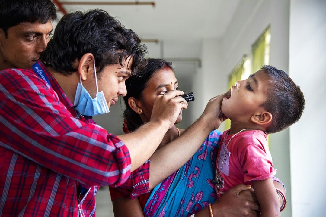 Operation Smile India dentist Dr. Dipanjan Chakroborty examines Shyam during his comprehensive health evaluation at the Durgapur Cleft Centre. Photo: Rohanna Mertens.