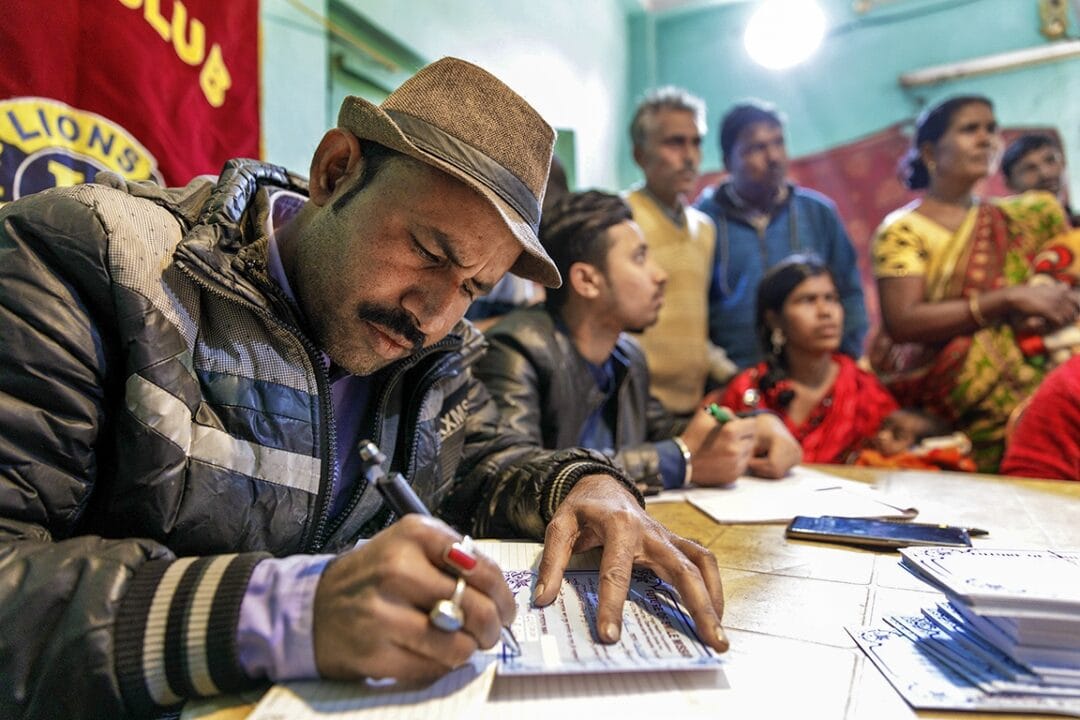 Operation Smile India's patient management coordinator Safiur Rehman "Mithu" Seikh gathers a patient’s information at the Murarai patient recruitment camp. Photo: Lorenzo Monacelli.