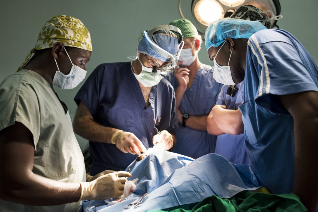 Head Neck Surgeon Francis Hart teaching to local surgery residents during the surgical rotation in Rwanda