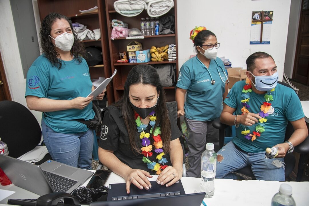 National registry coordinator Paola Arroyave, center, is surrounded by center coordinator Rosa Solares, left, pediatrician Dr. Alma Castaneda and nonmedical volunteer Guillermo Castaneda during a 2022 Operation Smile surgical programme in Guatemala City. Photo: Rohanna Mertens.