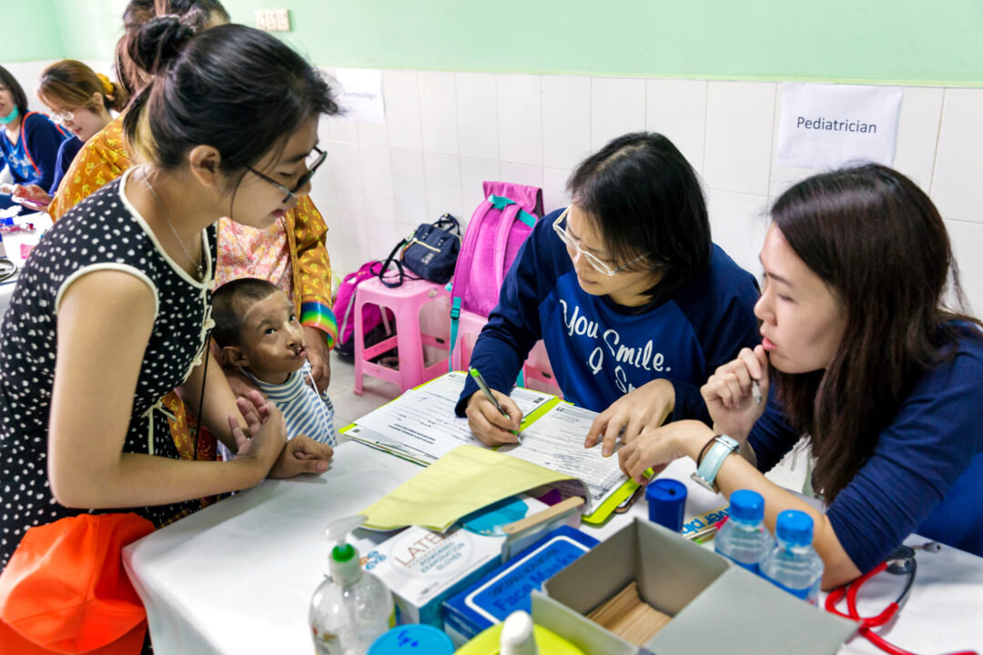 Six-year-old boy with cleft and medical volunteers