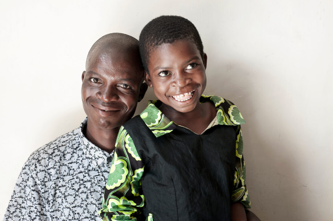 Mina and her dad after cleft surgery.