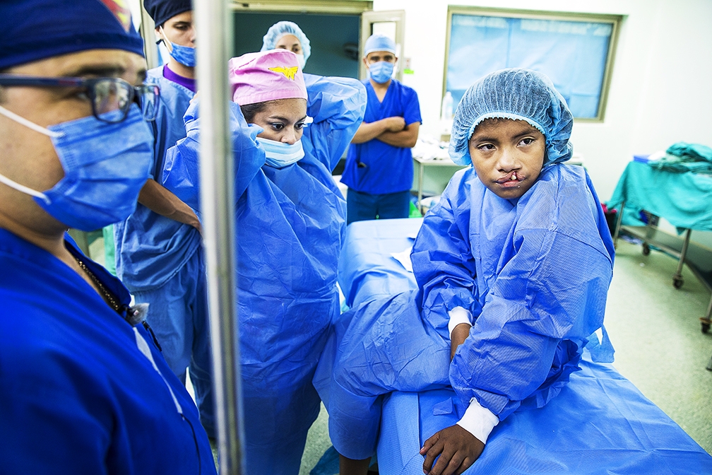 In the operating room, Iris is moments away from undergoing anaesthesia to receive her life-changing cleft lip surgery. Photo: Jörgen Hildebrandt.