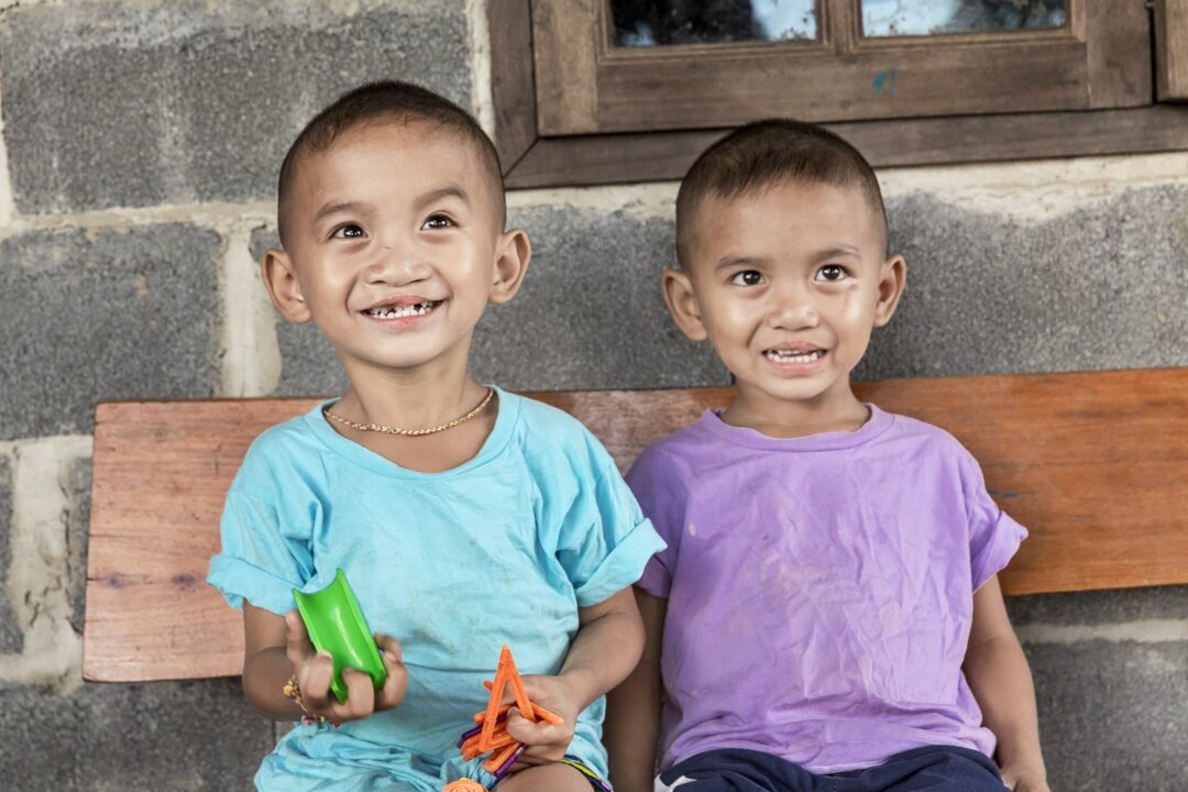 Ou, left, and Lak, three years after their cleft lip surgeries. Photo: Peter Stuckings.